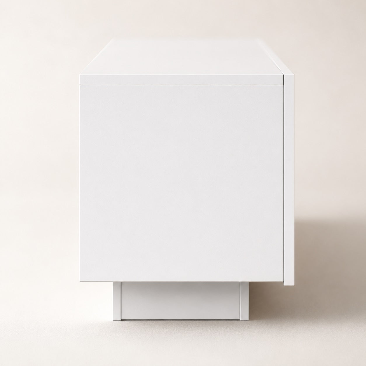 Vue latérale d’un meuble TV moderne blanc avec rangement et lignes épurées